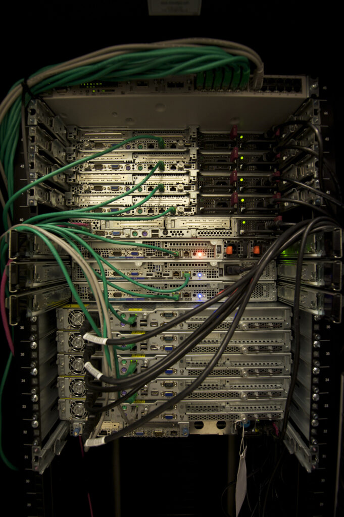 Rack-mounted server units with cabling visible around the equipment.